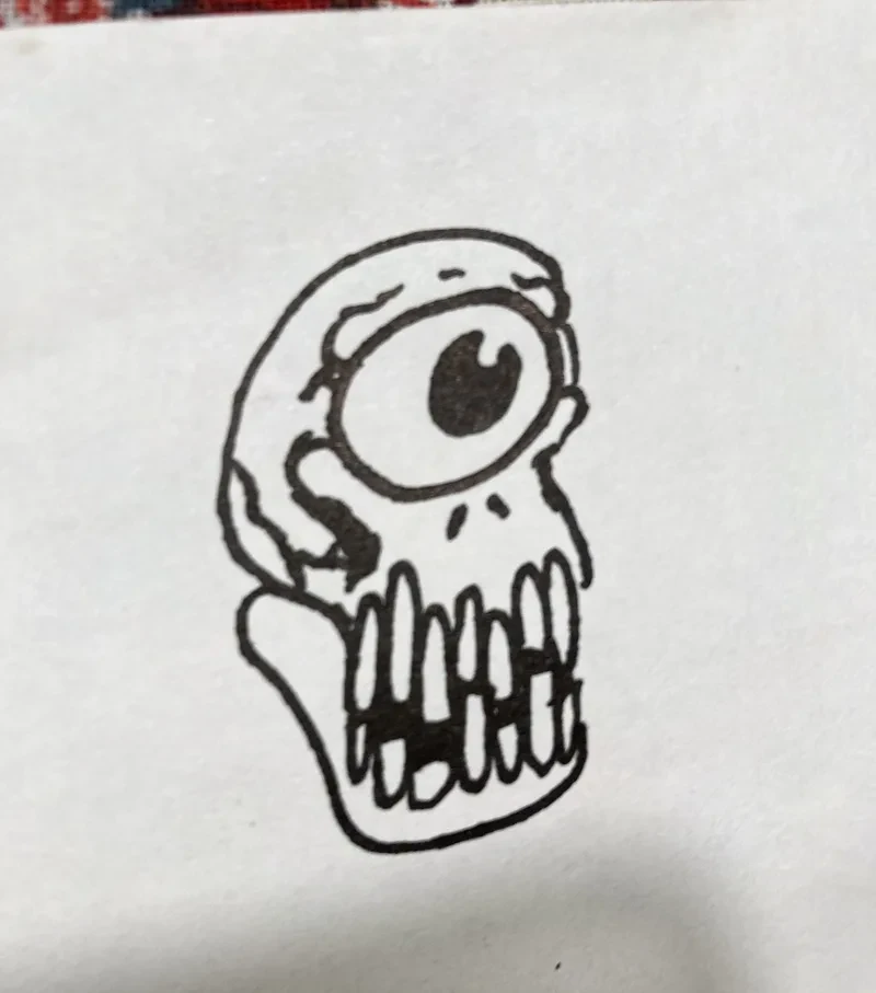 One eyed skull with big teeth
