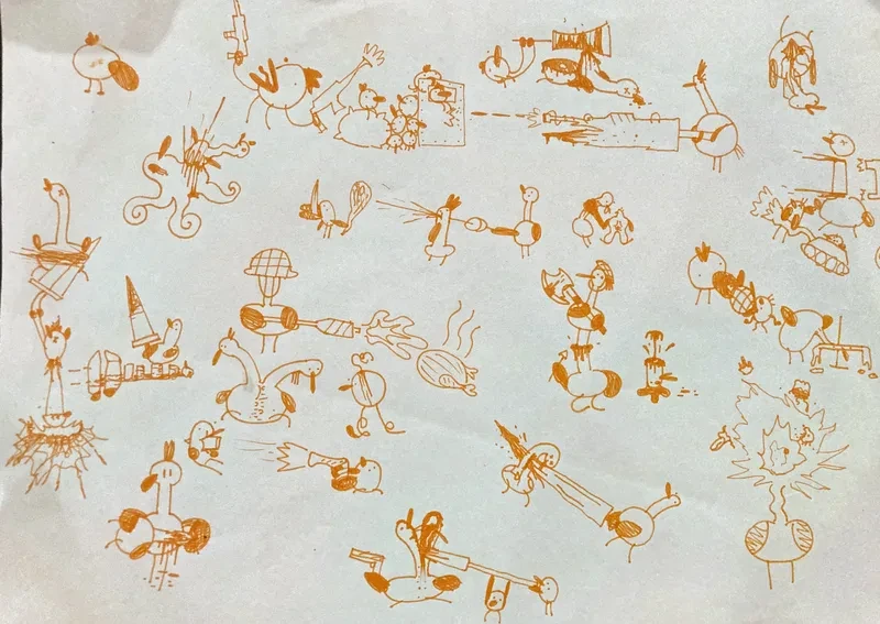 Orange pen stick figure doodles