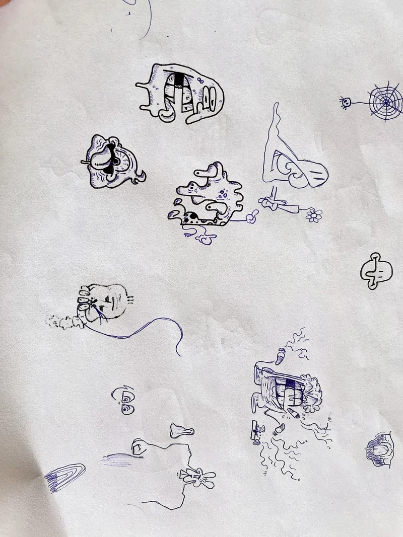 Small ink monsters on paper